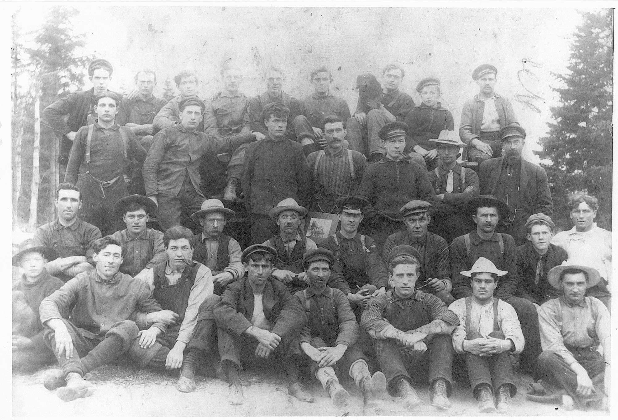 Damien LeBlanc with his men at the lumber camp